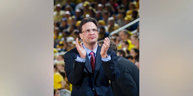 FILE - In this March 8, 2014, file photo, Indiana head coach Tom Crean claps his hands courtside in the second half of an NCAA college basketball game against Michigan at Crisler Center in Ann Arbor, Mich. Nearly eight months after the stunning conclusion to a mediocre season, the Hoosiers have made an attitude adjustment that could change everything.(AP Photo/Tony Ding, File)
