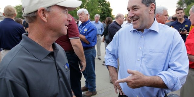 FILE: Aug. 3, 2012: Indiana Gov. Mitch Daniels, left, chats with Rep. Joe Donnelly, D-Ind., at the state fair in Indianapolis.