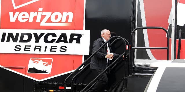 FILE - In this May 18, 2015, file photo, Derrick Walker, President of operations and competition of IndyCar, walks into the IndyCar operations trailer following the crash of James Hinchcliffe, of Canada, during practice for the Indianapolis 500 auto race at Indianapolis Motor Speedway in Indianapolis. Derrick Walker might be one of the most liked officials in the IndyCar Series. He also has one of the toughest jobs. (AP Photo/Darron Cummings, File)