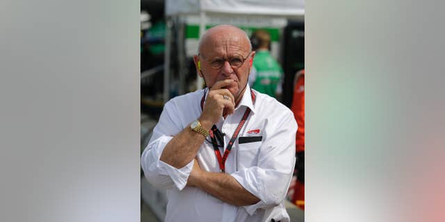 In this photo taken on Friday, May 8, 2015, Derrick Walker, President of operations and competition of IndyCar watches during practice for the Grand Prix of Indianapolis auto race at the Indianapolis Motor Speedway in Indianapolis. Derrick Walker might be one of the most liked officials in the IndyCar Series. He also has one of the toughest jobs. (AP Photo/Darron Cummings)