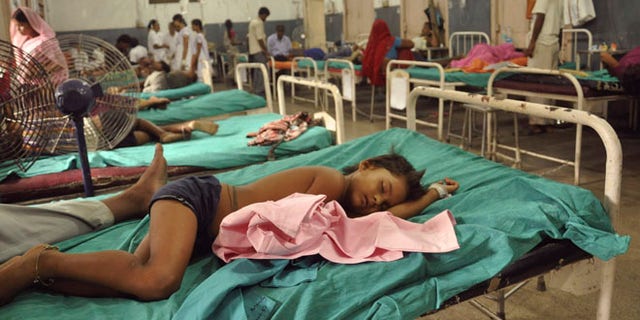 July 17, 2013: In this file photograph, Indian children who fell sick after eating a free school lunch lie at a hospital in Patna, India.