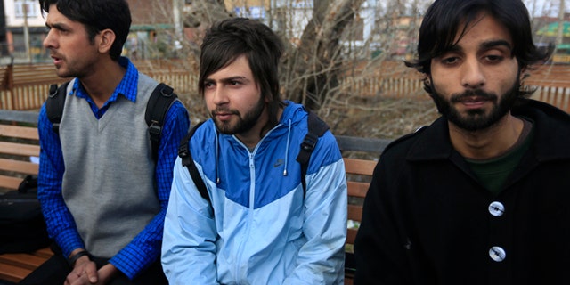 March 6, 2014: Three among the dozens of Kashmiri students expelled from their university from left, Gulzar Ahmed, Muteebul Majid, and Aijaz Bhat, speak to journalists in Srinagar, India.