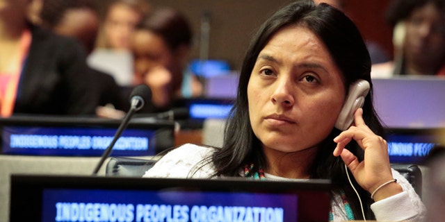 Ati Quigua, an indigenous leader from Colombia, listens during the 15th session of the U.N. Permanent Forum on Indigenous Issues, Tuesday May 17, 2016 at U.N. headquarters. (AP Photo/Bebeto Matthews)