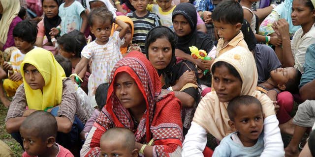 Rohingya Muslims flee Burma following intense fighting