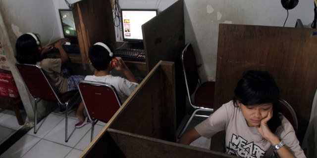 Oct. 19, 2012: Indonesian youths browse at an internet cafe in Jakarta, Indonesia.