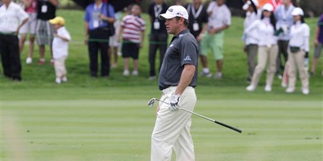 April 23, 2011: Lee Westwood of England watches his shot during the third round of the Indonesian Masters golf tournament at Royale Golf Club in Jakarta, Indonesia.