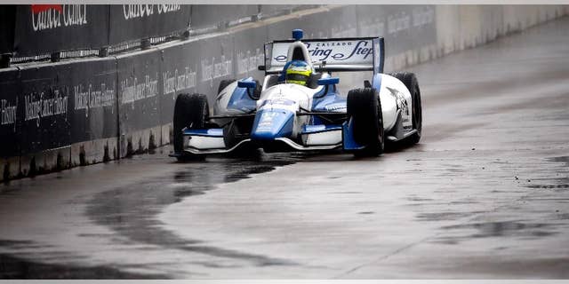 Carlos Huetas (18), of Colombia, drives into Turn 3 during the first of two IndyCar Grand Prix of Houston auto races Saturday, June 28, 2014, in Houston. Huetas won the race. (AP Photo/David J. Phillip)