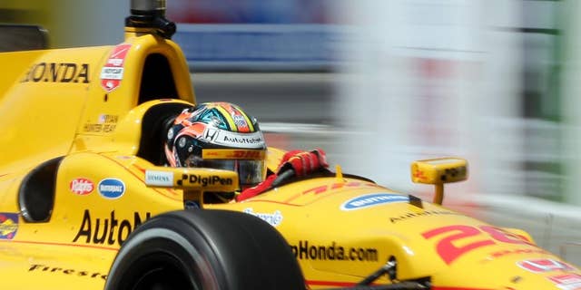 FILE - In this April 17, 2015, file photo, Ryan Hunter-Reay drives during a practice run for the IndyCar race at the Toyota Grand Prix of Long Beach in Long Beach, Calif. The two-time defending race champion returns to Alabama this weekend after a rough start that included a penalty from IndyCar with which he adamantly disagrees. (AP Photo/Chris Carlson, File)