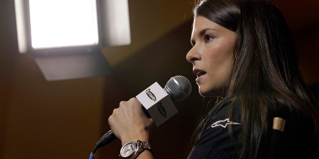Danica Patrick answers a question at a news conference during the NASCAR Media Tour in Concord, N.C., Monday, Jan. 23, 2012. Patrick will not run in the Indianapolis 500 this season and instead will drive in the Coca-Cola 600, NASCAR's longest race of the year. (AP Photo/Chuck Burton)
