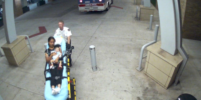 Hospital surveillance footage shows a woman and a two-month-old boy police are looking for.