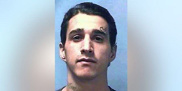 This undated photo provided by the Nevada Department of Corrections shows Carlos Manuel Perez Jr., 28. The Clark County Coroner in Las Vegas said Wednesday, March 25, 2015, that Perez's death on Nov. 12, 2014, of multiple gunshots to the head, neck, chest and arms at High Desert State Prison was a homicide. (AP Photo/Nevada Department of Corrections)