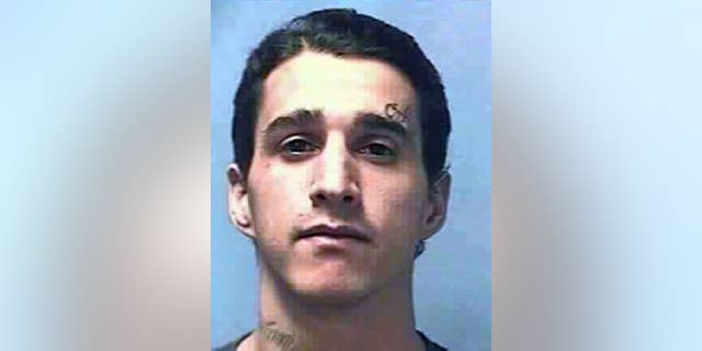 This undated photo provided by the Nevada Department of Corrections shows Carlos Manuel Perez Jr., 28. The Calrk County Coroner in Las Vegas said Wednesday, March 25, 2015, that Perez’s death on Nov. 12, 2014, of multiple gunshots to the head, neck, chest and arms at High Desert State Prison was a homicide. Murphy says a homicide ruling means Perez died at the hands of another person. It doesn’t establish fault. (AP Photo/Nevada Department of Corrections)