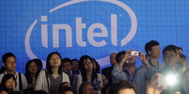 People take pictures in the Intel booth at the Computex 2010 computer fair in Taipei June 1, 2010.