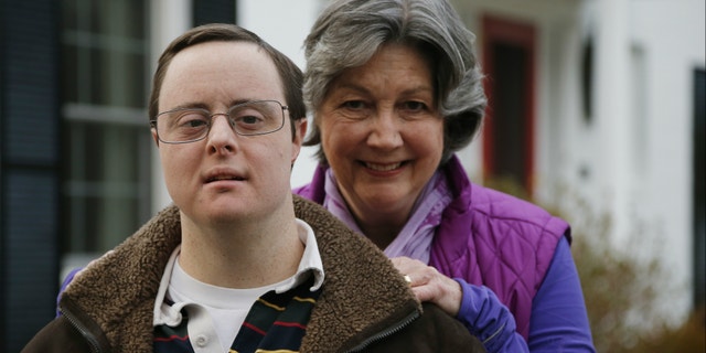 Matthew McMeekin, along with his mother, Bebe McMeekin, pose for a photograph at their home in Bethesda, Md. Most Americans with intellectual or developmental disabilities remain shut out of the workforce, despite changing attitudes and billions spent on government programs to help them.