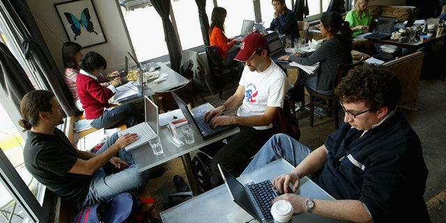 SAN FRANCISCO, CA - APRIL 9:  Customers at the Canvas Cafe take advantage of free wireless "wi-fi" internet access April 9, 2004 in San Francisco. According to a new study sponsored by Intel Corp., the San Francisco Bay area is the nation's top market for wireless Internet hot spots followed by Orange County, Calif., Washington, D.C., and Austin, Texas. (Photo by Justin Sullivan/Getty Images)