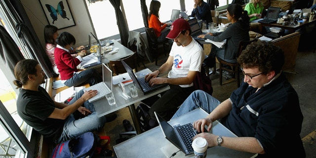 SAN FRANCISCO, CA - APRIL 9: Customers at the Canvas Cafe take advantage of free wireless "wi-fi" internet access April 9, 2004 in San Francisco. According to a new study sponsored by Intel Corp., the San Francisco Bay area is the nation's top market for wireless Internet hot spots followed by Orange County, Calif., Washington, D.C., and Austin, Texas. (Photo by Justin Sullivan/Getty Images)