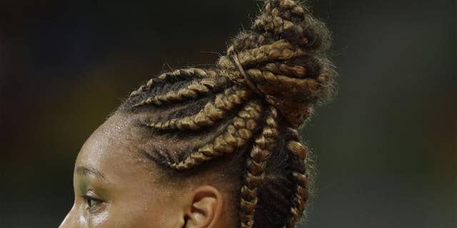 France's Beatrice Edwige wears her hair in braids during the women's preliminary handball match between South Korea and France at the 2016 Summer Olympics in Rio de Janeiro on Aug. 12, 2016.
