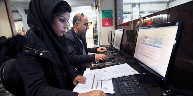 Jan. 6, 2013: Iranians surf the web in an internet cafe at a shopping center, in central Tehran. Iranian authorities have blocked many foreign-based virtual private networks, or VPNs, severely restricting access to many websites.