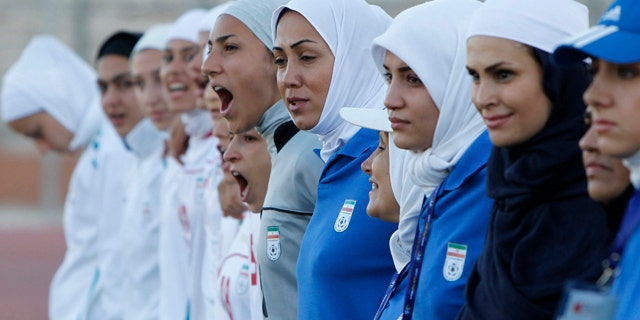 The Iranian women's national soccer team lines up before its qualifying match against Jordan for the 2012 London Olympic Games in Amman, June 3, 2011. The Iranian team was banned from the match on Friday in the second round of qualifiers in protest against guidelines on its headscarves.