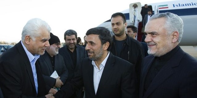 Jan. 14, 2012: Iran's President Mahmoud Ahmadinejad (C) as First Vice President Mohammad Reza Rahimi looks on at Tehran's Mehrabad airport after Ahmadinejad's visit to Latin American countries