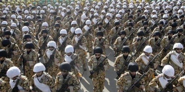 April 17, 2012: Iranian troops march during a military parade commemorating National Army Day in front of the mausoleum of the late revolutionary founder Ayatollah Khomeini, outside Tehran, Iran.