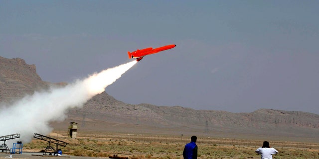 This file photo released on Sunday, Aug. 22, 2010, by the Iranian Defense Ministry, claims to show the launch of the Karrar, or striker in Farsi, the country's first domestically-built, long-range, unmanned bomber aircraft at an undisclosed location. In military maneuvers and air shows, Iran has been proudly touting advances in its air forces and defenses, including radar systems, anti-aircraft batteries and new attack and reconnaissance drones.