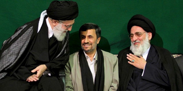 In this Saturday, May 7, 2011 photo released by an official website of the Iranian supreme leader's office, Iranian supreme leader Ayatollah Ali Khamenei, left, greets former Judiciary chief Ayatollah Mahmoud Hashemi Shahroudi, right, as President Mahmoud Ahmadinejad sits at center, during a religious ceremony, in Tehran, Iran. (AP)