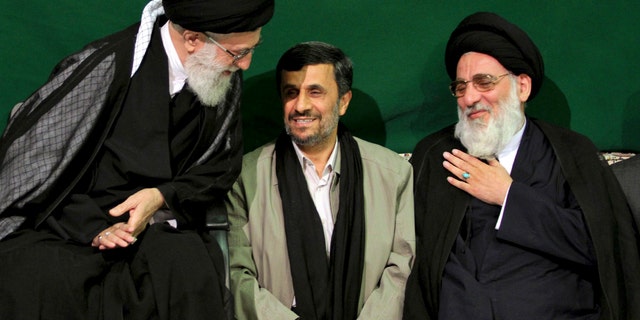 In this Saturday, May 7, 2011 photo released by an official website of the Iranian supreme leader's office, Iranian supreme leader Ayatollah Ali Khamenei, left, greets former Judiciary chief Ayatollah Mahmoud Hashemi Shahroudi, right, as President Mahmoud Ahmadinejad sits at center, during a religious ceremony, in Tehran, Iran. (AP)