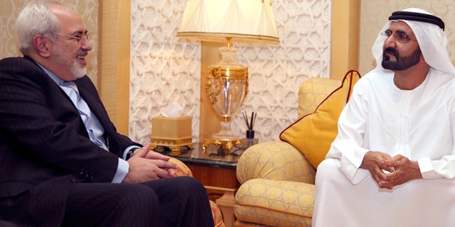 April 15, 2014: In this image released by the Emirates News Agency, WAM, Iranian Foreign Minister Mohamad Javad Zarif, left, meets with Sheikh Mohammed bin Rashid Al Maktoum, UAE Prime Minister and ruler of Dubai to discuss bilateral relations and regional developments, in Dubai, United Arab Emirates.
