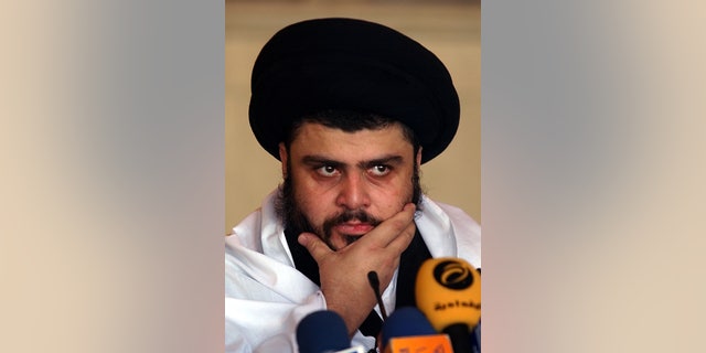 Sep. 22, 2006: In this file photo, Radical Shiite cleric Muqtada al-Sadr delivers a Friday sermon, in a Mosque, in Kufa, Iraq. Iraqi officials said al-Sadr returned to Iraq after a nearly 3-year absence.