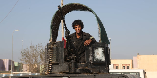 March 15, 2015 - A young volunteer militiaman on his way to the battlefield against Islamic State fighters in Tikrit, 80 miles north of Baghdad, Iraq. Kurdish forces in Iraq are investigating 2 other possible ISIS chemical weapons attacks, a top official said Monday, as authorities put an Iraqi offensive to retake Saddam Hussein's hometown on hold.