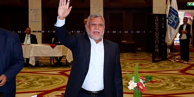Hadi al-Amiri, commander of the Popular Mobilization Forces, gestures after casting his ballot in the country's parliamentary elections in the heavily fortified Green Zone in Baghdad, Iraq.