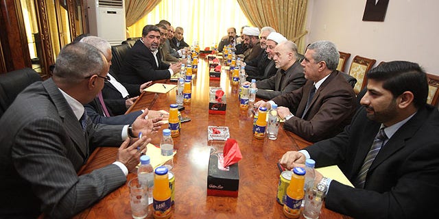 Oct. 1, 2010: Representatives of Shiite cleric Muqtada al-Sadr and Iraqi Prime Minister Nouri al-Maliki's political parties meet in Baghdad, Iraq.