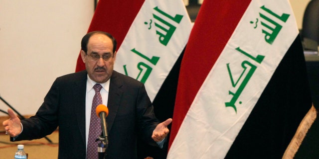 Dec. 21: Iraq's Prime Minister Nouri al-Maliki speaks to the Iraqi lawmakers before submitting his new government for approval in Baghdad, Iraq.