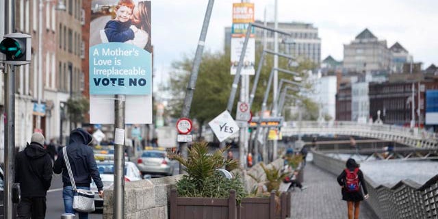 May 18, 2015: No and Yes campaign posters are seen in Dublin, Ireland. (AP Photo/Peter Morrison)