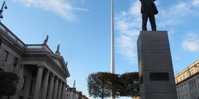 In this picture taken on Monday, Oct. 6, 2014, Dublin's colonnaded General Post Office is seen, left, a national monument to Ireland's independence fight. The Irish nationalist Sinn Fein party is seeking to triumph in Ireland's next elections expected in 2016, the 100th anniversary of an Easter Rising against British rule that rebel commanders directed from the post office. A new poll has made Sinn Fein as popular as the main Irish government party for the first time. (AP Photo/Shawn Pogatchnik)