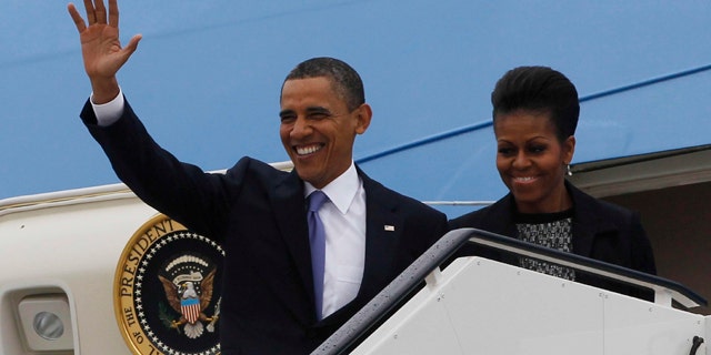 May 23: U.S. President Barack Obama and first lady Michelle Obama step off Air Force One as they arrive in Dublin, Ireland. President Barack Obama opens a six-day European tour with a quick dash through Ireland, where he will celebrate his own Irish roots and look to give a boost to a nation grappling with the fallout from its financial collapse.