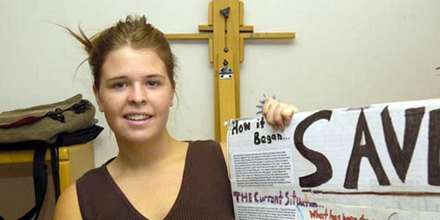 In this May 30, 2013, photo, Kayla Mueller is shown after speaking to a group in Prescott, Ariz. The parents of the late American hostage Kayla Mueller say they were told by American officials that their daughter was repeatedly forced to have sex with Abu Bakr Baghdadi, the leader of the Islamic State group. (AP Photo/The Daily Courier, Jo. L. Keener ) MANDATORY CREDIT