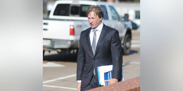 Attorney Ken Coghlan, representing Jaelyn Delshaun Young, enters federal court for a hearing in Oxford, Miss. on Tuesday, Aug. 11, 2015. Young, and Muhammad Oda Dakhlalla, were arrested over the weekend on charges that they were trying to travel abroad to join the Islamic State militant group. (Bruce Newman/Oxford Eagle via AP)
