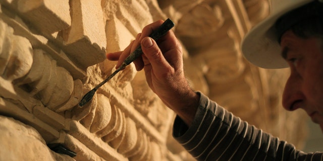 Jan. 15, 2012: A restorer at the Israel Museum works on a reassembled display of what curators say was Herod's tomb in the Israeli museum, Jerusalem. Israel's national museum is opening the world's first exhibition on the King, displaying what it says are the reconstructed tomb and sarcophagus of one of antiquity's most towering and despised figures.