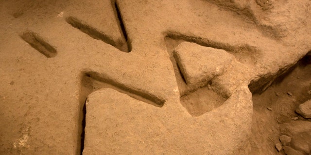 Dec. 1, 2011: Marks carved in the bedrock over 2,800 years ago, seen in an archeological excavation in the city of David near Jerusalem's Old City, have archaeologists stumped.