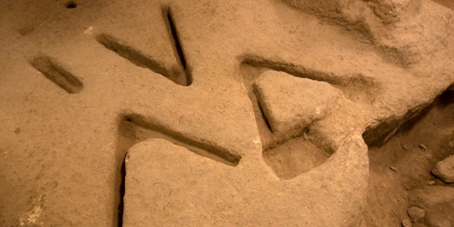 Dec. 1, 2011: Marks carved in the bedrock over 2,800 years ago, seen in an archeological excavation in the city of David near Jerusalem's Old City, have archaeologists stumped.