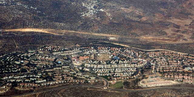 In this Sept. 20, 2010 aerial file photo, taken through the window of an airplane, the West Bank Jewish settlement of Ariel is seen.