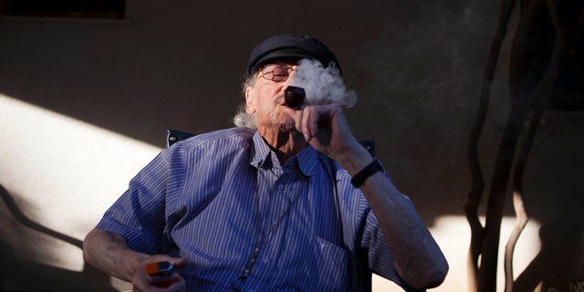 Oct. 30, 2012: Moshe Rute, 80, smokes medical cannabis at the old age nursery home in kibbutz Naan next to the city of Rehovot, Israel. Marijuana is illegal in Israel but medical use has been permitted since the early nineties for cancer patients and those with pain-related illnesses such as Parkinson's, Multiple Sclerosis, and even post-traumatic stress disorder.