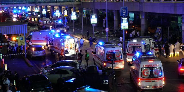 ISTANBUL, TURKEY - JUNE 28: Security and ambulances block the road outside Turkey's largest airport, Istanbul Ataturk, after it was hit by a suicide bomb attack on June 28, 2016, Turkey. Two suicide bombers opened fire before blowing themselves up at the entrance to the main international airport in Istanbul, killing at least 10 people and wounding at least 60 people according to Justice Minister Bekir Bozdagç. (Photo by Mehmet Ali Poyraz/Getty Images)