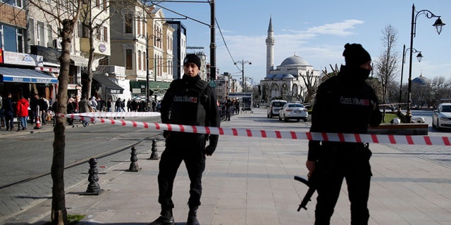 Policemen secure the historic Sultanahmet district after an explosion in Istanbul, Tuesday, Jan. 12, 2016. An explosion killed at least 10 people and wounded 15 others Tuesday morning in a historic district of Istanbul popular with tourists. Turkish President Recep Tayyip Erdogan said a Syria-linked suicide bomber is believed to be behind the attack. (AP Photo/Emrah Gurel)