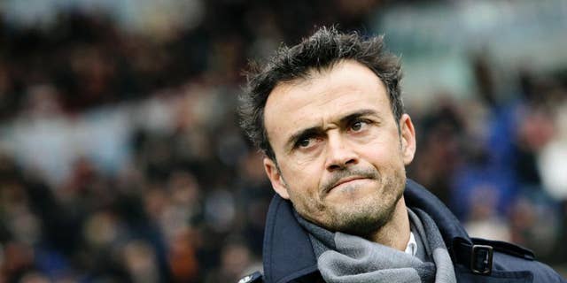 FILE - In this Sunday, Feb. 19, 2012, file photo, AS Roma coach Luis Enrique, of Spain, waits for the start of a Series A soccer match between AS Roma and Parma, at Rome's Olympic stadium. Barcelona has hired Luis Enrique as its new coach, succeeding Gerardo Martino who stepped down on Saturday after the club failed to defend its Spanish league title. Barcelona said on its website Monday, May 19, 2014, that Enrique has agreed to a two-year deal. (AP Photo/Riccardo De Luca, File)