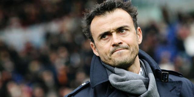 FILE - In this Sunday, Feb. 19, 2012, file photo, AS Roma coach Luis Enrique, of Spain, waits for the start of a Series A soccer match between AS Roma and Parma, at Rome's Olympic stadium. Barcelona has hired Luis Enrique as its new coach, succeeding Gerardo Martino who stepped down on Saturday after the club failed to defend its Spanish league title. Barcelona said on its website Monday, May 19, 2014, that Enrique has agreed to a two-year deal. (AP Photo/Riccardo De Luca, File)