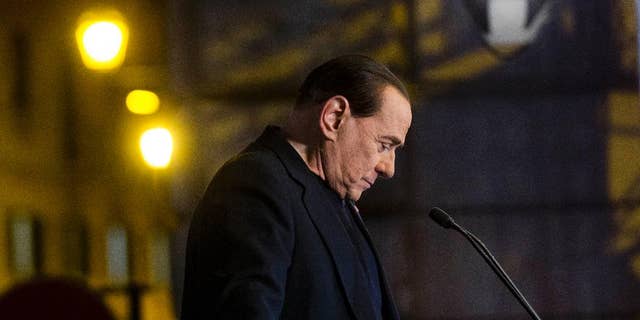 In this Wednesday, Nov. 27, 2013 file photo Silvio Berlusconi pauses during a rally in Rome. Italy's highest court has upheld a two-year political ban against Silvio Berlusconi stemming from his tax fraud conviction. The Court of Cassation ruling handed down late Tuesday, March 19, 2014 is the latest setback for Berlusconi, who was kicked out of Parliament last year after the high court upheld his conviction and four-year prison sentence. Despite the ban on holding or running for public office, Berlusconi remains a force in Italian politics, heading his Forza Italia party. (AP Photo/Alessandra Tarantino, File)
