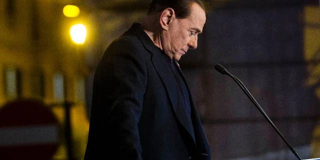 In this Wednesday, Nov. 27, 2013 file photo Silvio Berlusconi pauses during a rally in Rome. Italy's highest court has upheld a two-year political ban against Silvio Berlusconi stemming from his tax fraud conviction. The Court of Cassation ruling handed down late Tuesday, March 19, 2014 is the latest setback for Berlusconi, who was kicked out of Parliament last year after the high court upheld his conviction and four-year prison sentence. Despite the ban on holding or running for public office, Berlusconi remains a force in Italian politics, heading his Forza Italia party. (AP Photo/Alessandra Tarantino, File)